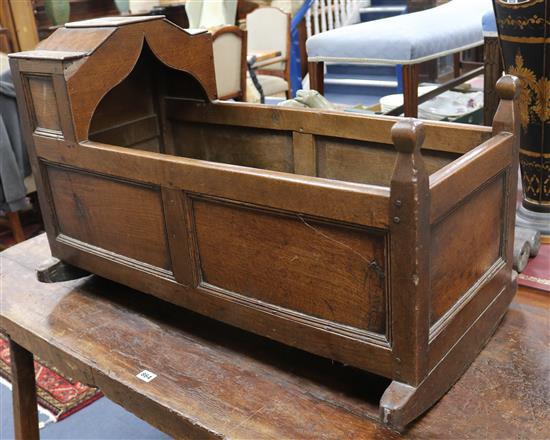 An 18th century oak cradle W.89cm